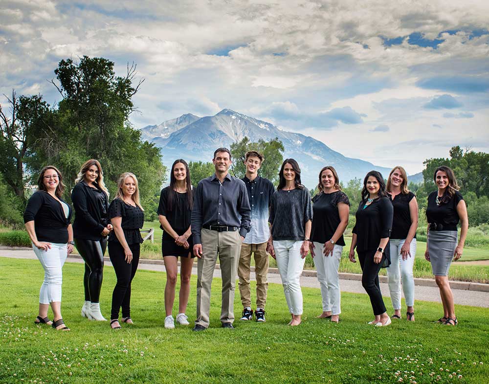 our glenwood springs dentistry team in from of mount sopris