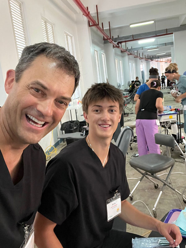 father and son in dental team in grenada